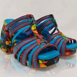 Handmade platform strappy multi-color open back slide heel pair from the side