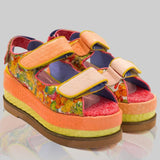 handmade platform sandal in vibrant orange, yellow, and red with adjustable straps pair from side