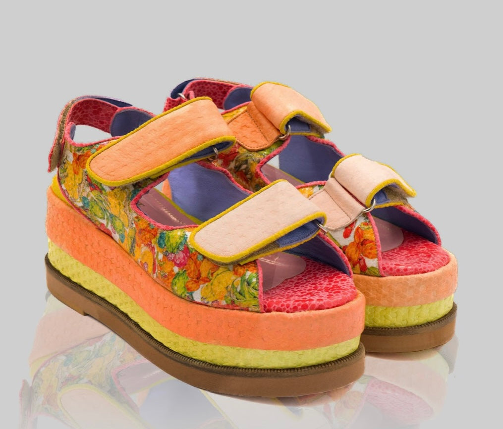 handmade platform sandal in vibrant orange, yellow, and red with adjustable straps pair from side