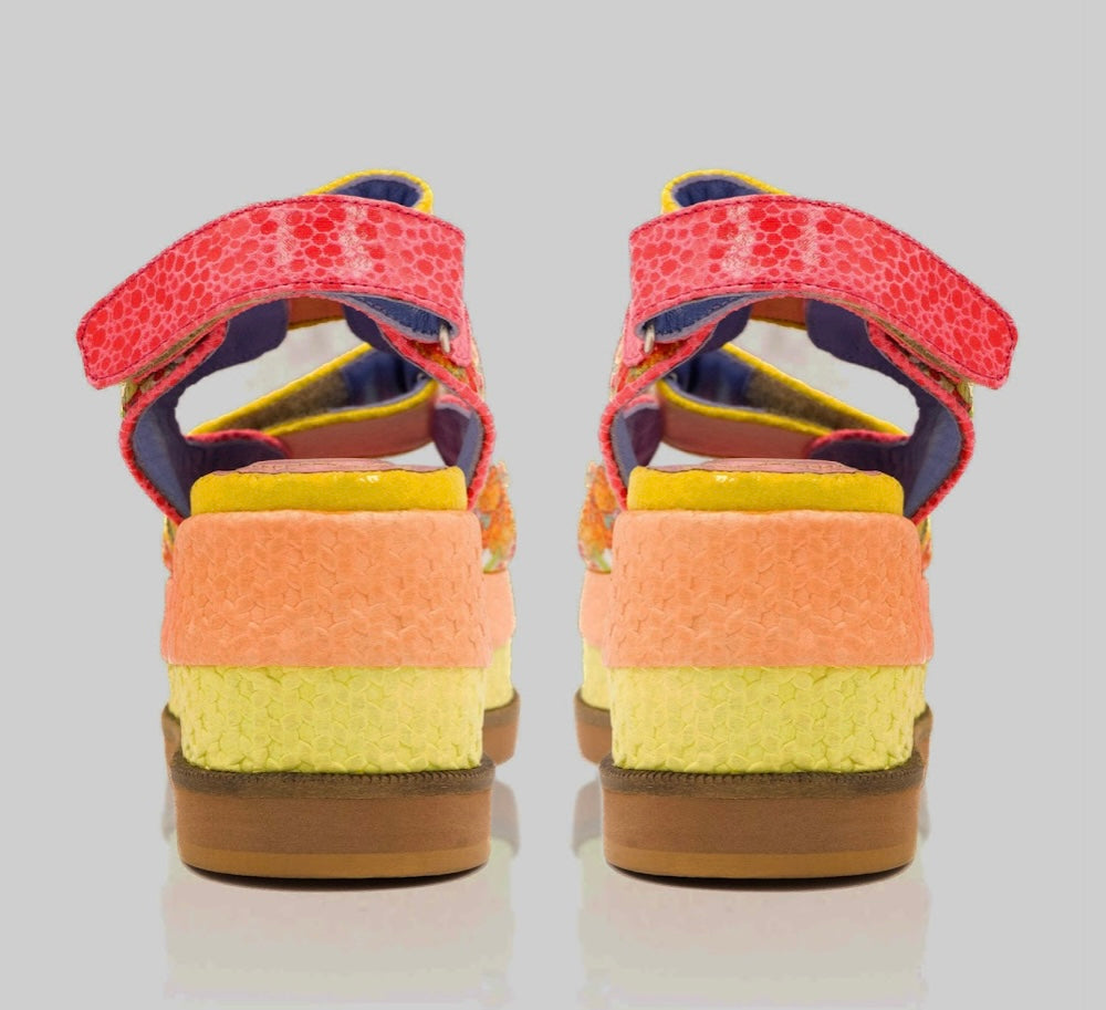 handmade platform sandal in vibrant orange, yellow, and red with adjustable straps pair from back