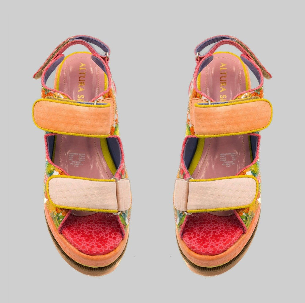 handmade platform sandal in vibrant orange, yellow, and red with adjustable straps pair from top