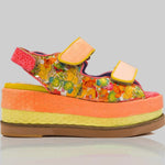 handmade platform sandal in vibrant orange, yellow, and red with adjustable straps detail