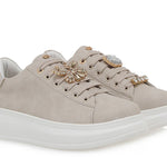 beige suede like platform sneaker with laces and bejeweled butterfly jewelry pair