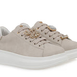 beige suede like platform sneaker with laces and bejeweled butterfly jewelry pair