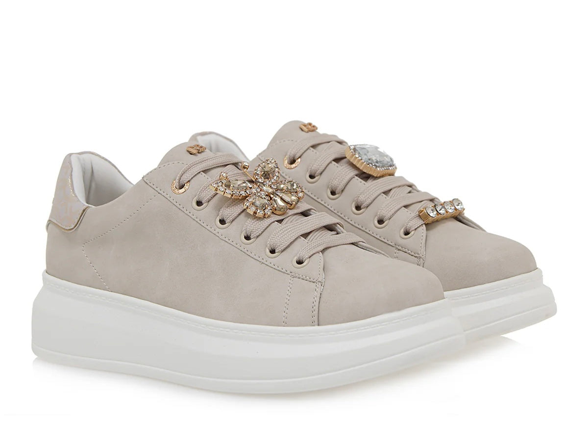 beige suede like platform sneaker with laces and bejeweled butterfly jewelry pair