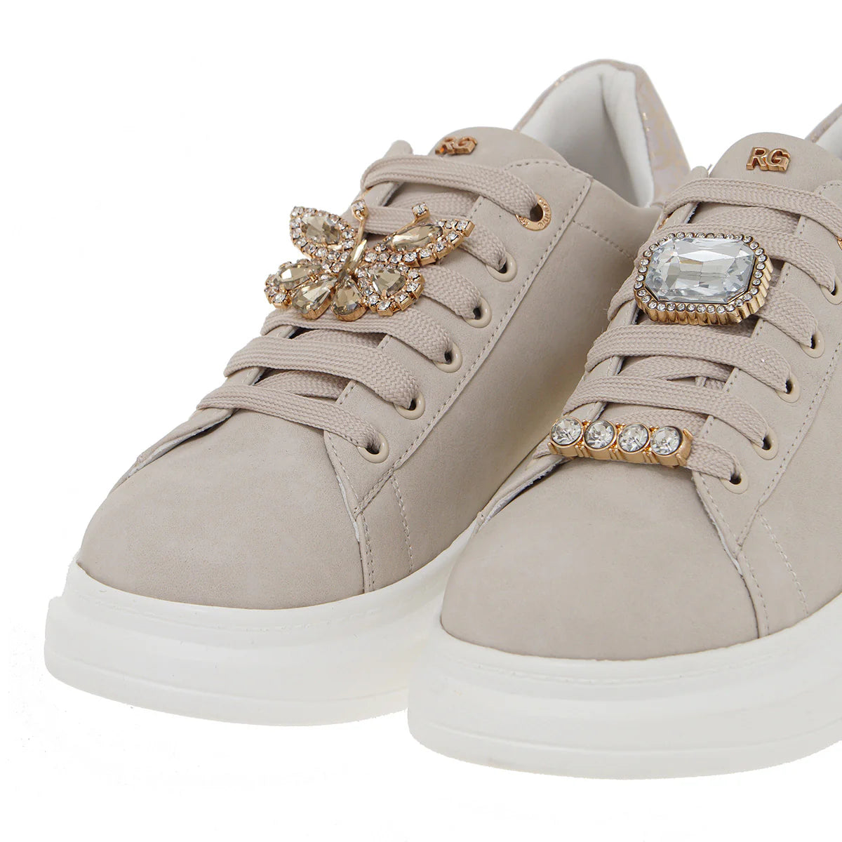 beige suede like platform sneaker with laces and bejeweled butterfly jewelry pair from front