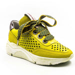 neon colored perforated platform sneaker with metallic back detail and patterned laces side view