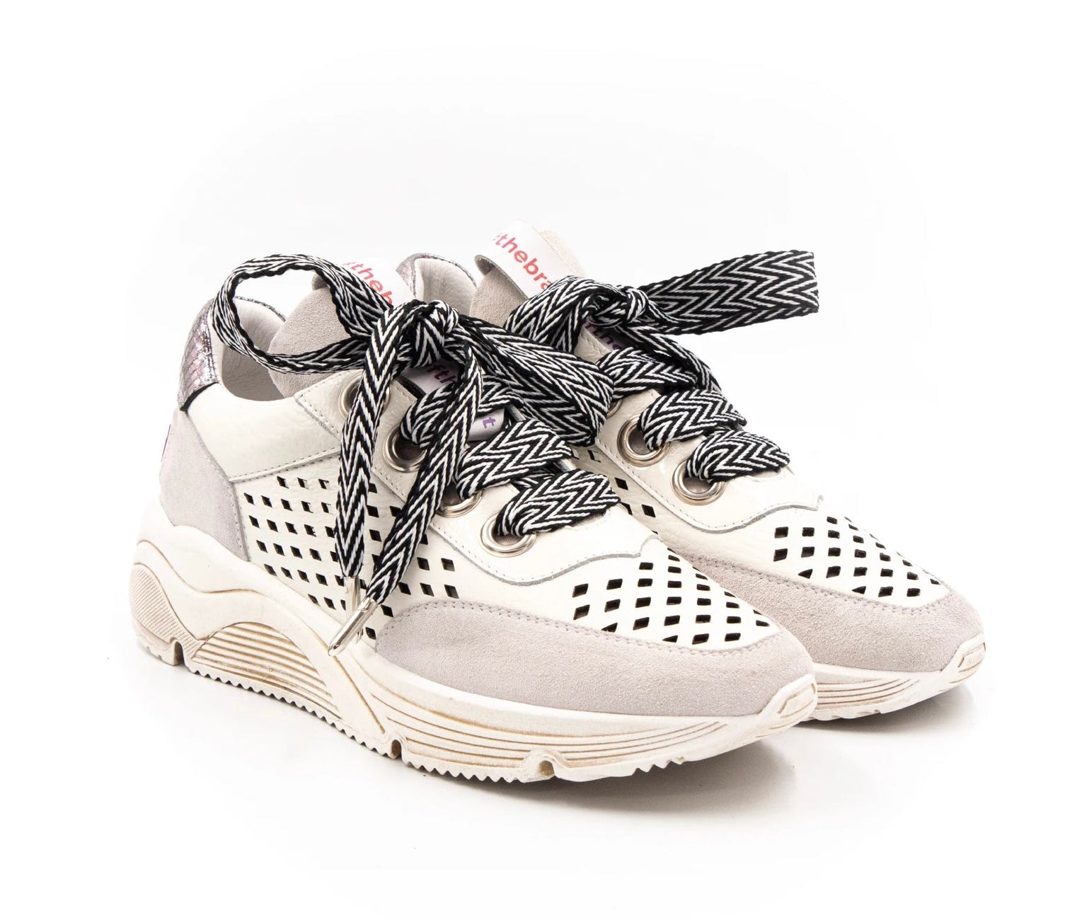 neutral colored perforated platform sneaker with metallic detail backing and patterned laces pair