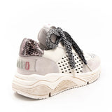 neutral colored perforated platform sneaker with metallic detail backing and patterned laces back side profile