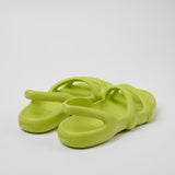 Light green molded modern flat sandal pair from back