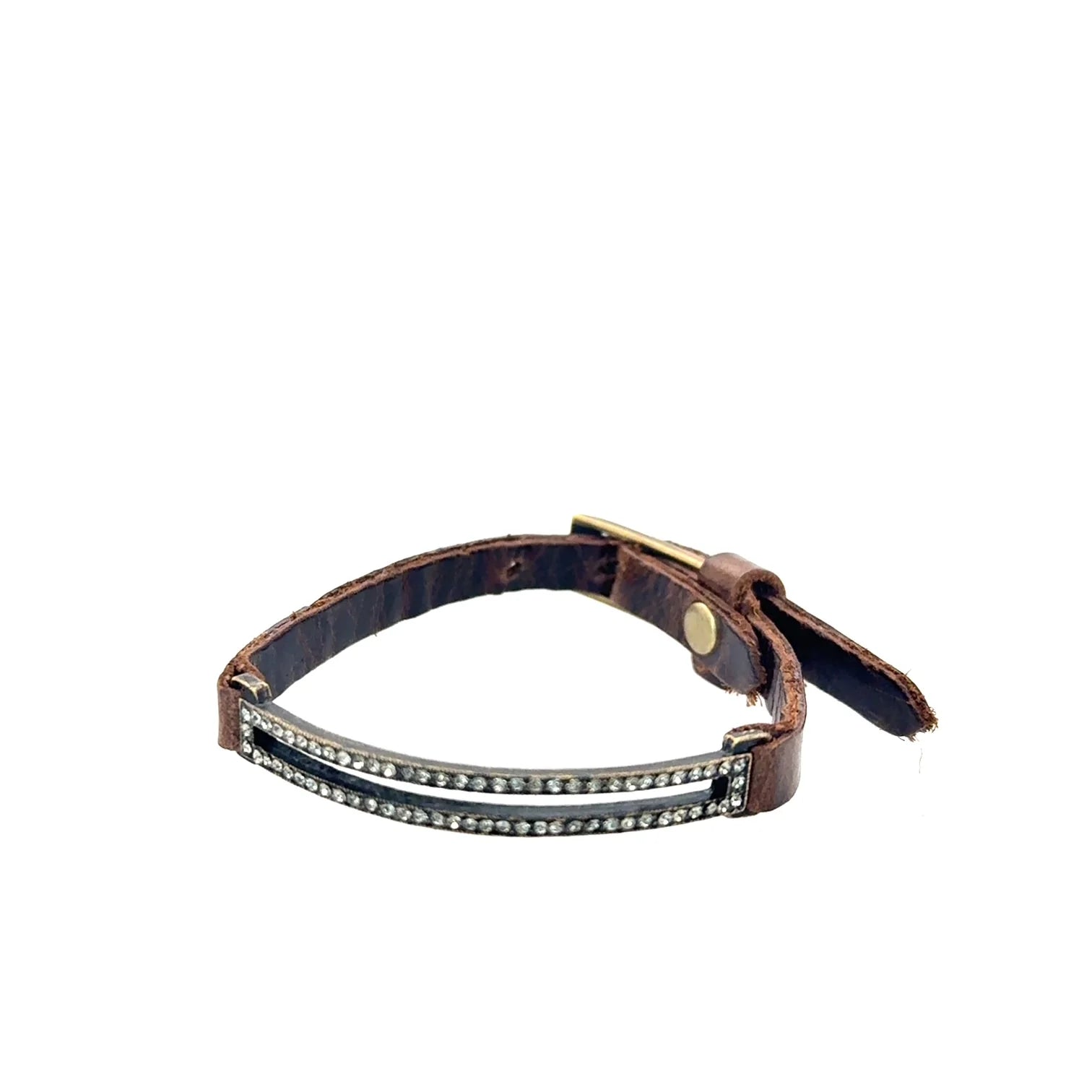 Rebel skinny pave rectangle leather bracelet. Antique brass finish with black diamond crystals. Genuine Italian leather with adjustable buckle closure.