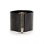 bracelet features a skinny rectangle accent on a wide leather band. Antique brass finish with black diamond crystal accents on a genuine Italian vintage black leather band. Adjustable snap closure. Handmade in New York.