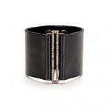 bracelet features a skinny rectangle accent on a wide leather band. Antique brass finish with black diamond crystal accents on a genuine Italian vintage black leather band. Adjustable snap closure. Handmade in New York.