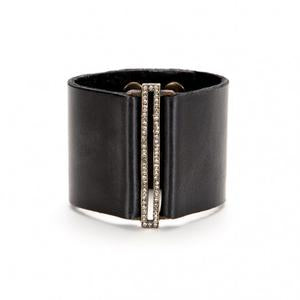 bracelet features a skinny rectangle accent on a wide leather band. Antique brass finish with black diamond crystal accents on a genuine Italian vintage black leather band. Adjustable snap closure. Handmade in New York.