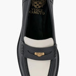 Black and cream colored leather loafer with heel full top view.