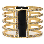 double sided five bar bracelet features 18K gold finish with black diamond crystals accents with genuine vintage Italian black leather. Adjustable snap closure. Handmade in New York.