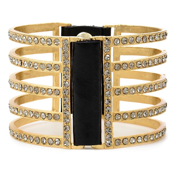 double sided five bar bracelet features 18K gold finish with black diamond crystals accents with genuine vintage Italian black leather. Adjustable snap closure. Handmade in New York.