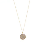 small pave disc necklace on a delicate chain. 18K gold finish with black diamond crystals. 16" chain with lobster clasp closure. Handmade in New York.
