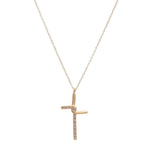 small pendant cross necklace features an interlocked half metal, half crystal cross. Made with 18K gold finish over brass with black diamond crystals accents on a 16" brass chain with lobster clasp closure. Handmade in New York.