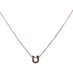 mini horseshoe pendant necklace features black diamond detailing on fine chain. Handmade in New York.