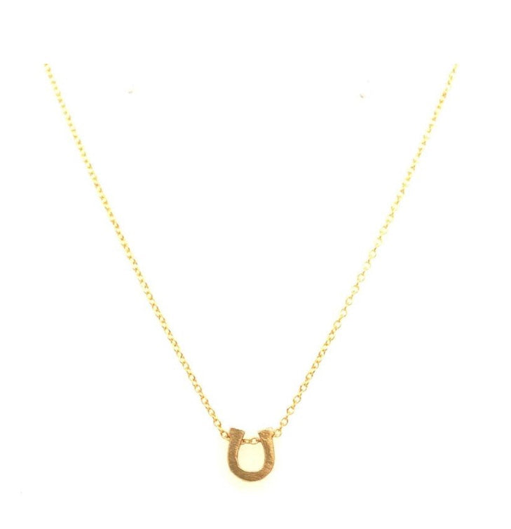 mini horseshoe pendant necklace features 18K gold plating on a fine chain. Handmade in New York.