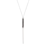crystal stacked necklace features an antique brass finish with black diamond crystal accents on a 16" delicate chain with lobster clasp closure. Handmade in New York.