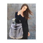 Genuine silver black fox fur handbag with cow horn handle. Made in the USA. Full feature on model.