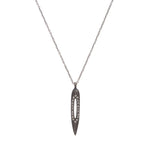 mall bullet necklace with crystal cutout features an antique brass finish with black diamond crystal accents. 16" delicate brass chain with a lobster clasp closure. Handmade in New York.