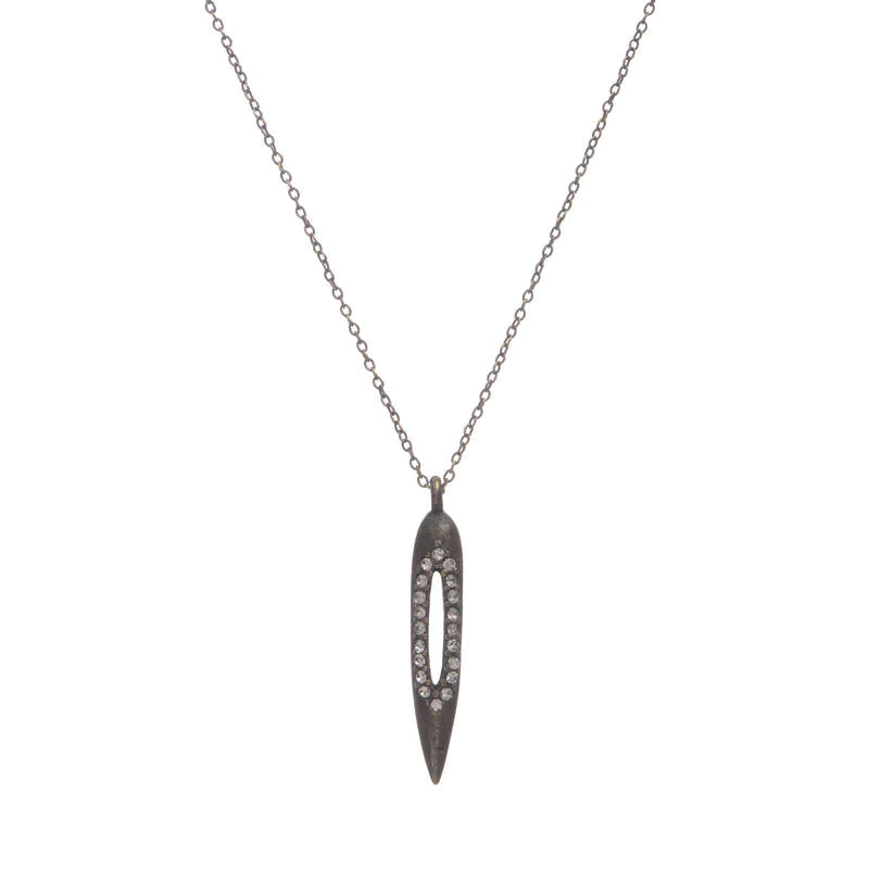 mall bullet necklace with crystal cutout features an antique brass finish with black diamond crystal accents. 16" delicate brass chain with a lobster clasp closure. Handmade in New York.