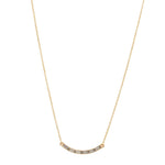 curved bar necklace with baguette crystals features 18K gold finish with Austrian crystal accents on a 16" chain with lobster clasp closure. Handcrafted in Brooklyn.