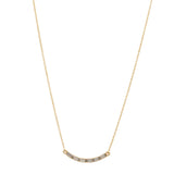 curved bar necklace with baguette crystals features 18K gold finish with Austrian crystal accents on a 16" chain with lobster clasp closure. Handcrafted in Brooklyn.