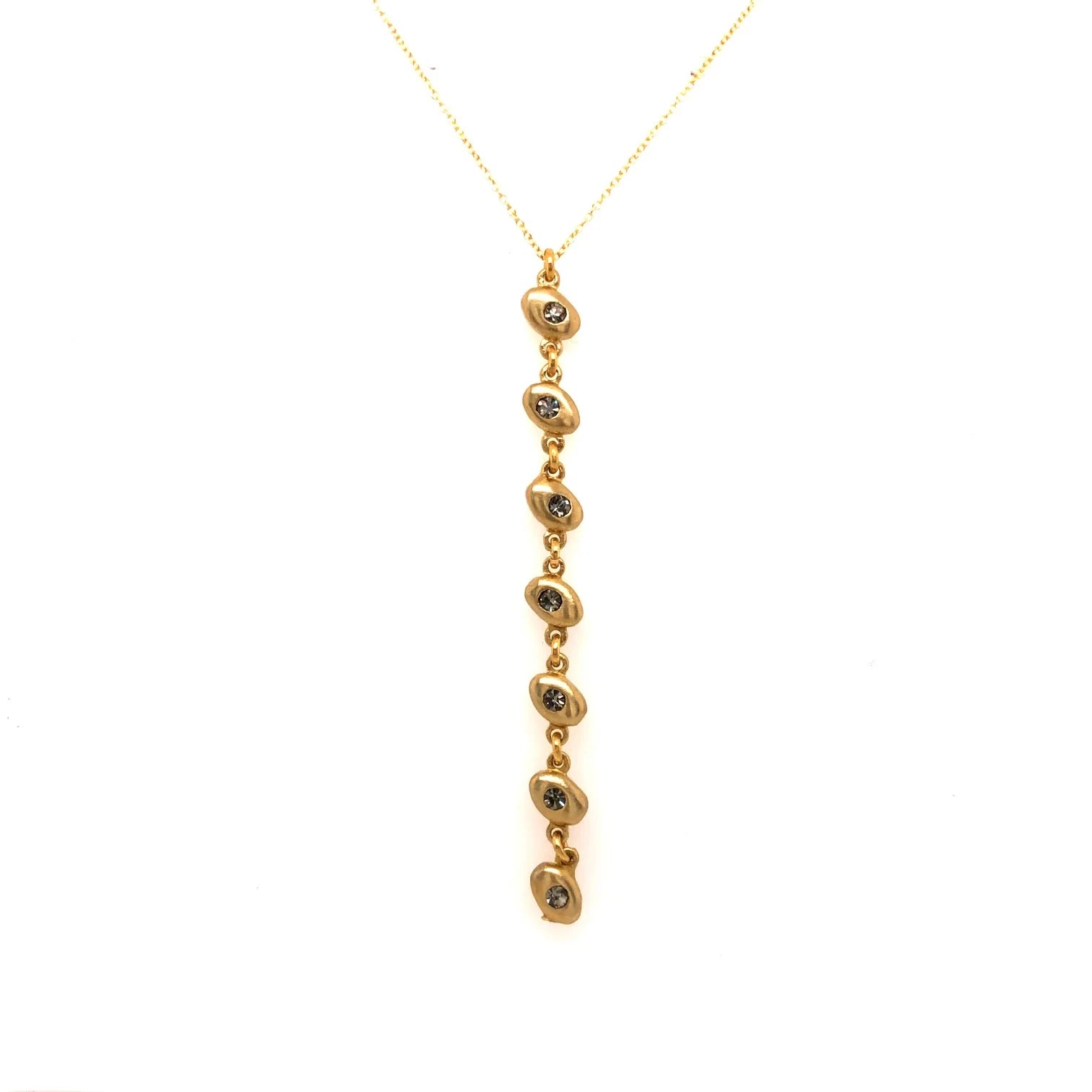 oval link drop pendant necklace features 18K gold finish with burnished black diamond crystal accents on a 16" fine chain with lobster clasp closure. Handcrafted in Brooklyn.