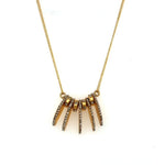 funky accent necklace features 18K gold plating over brass with black diamond accents. Handmade in New York.