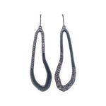 open center pear shaped crystal drop earrings feature an antique brass finish with black diamond crystals. Handmade in Brooklyn.