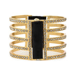double sided five bar bracelet features 18K gold finish with black diamond crystals accents with genuine vintage Italian black leather. Adjustable snap closure. Handmade in New York.