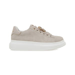 beige suede like platform sneaker with laces and bejeweled butterfly jewelry
