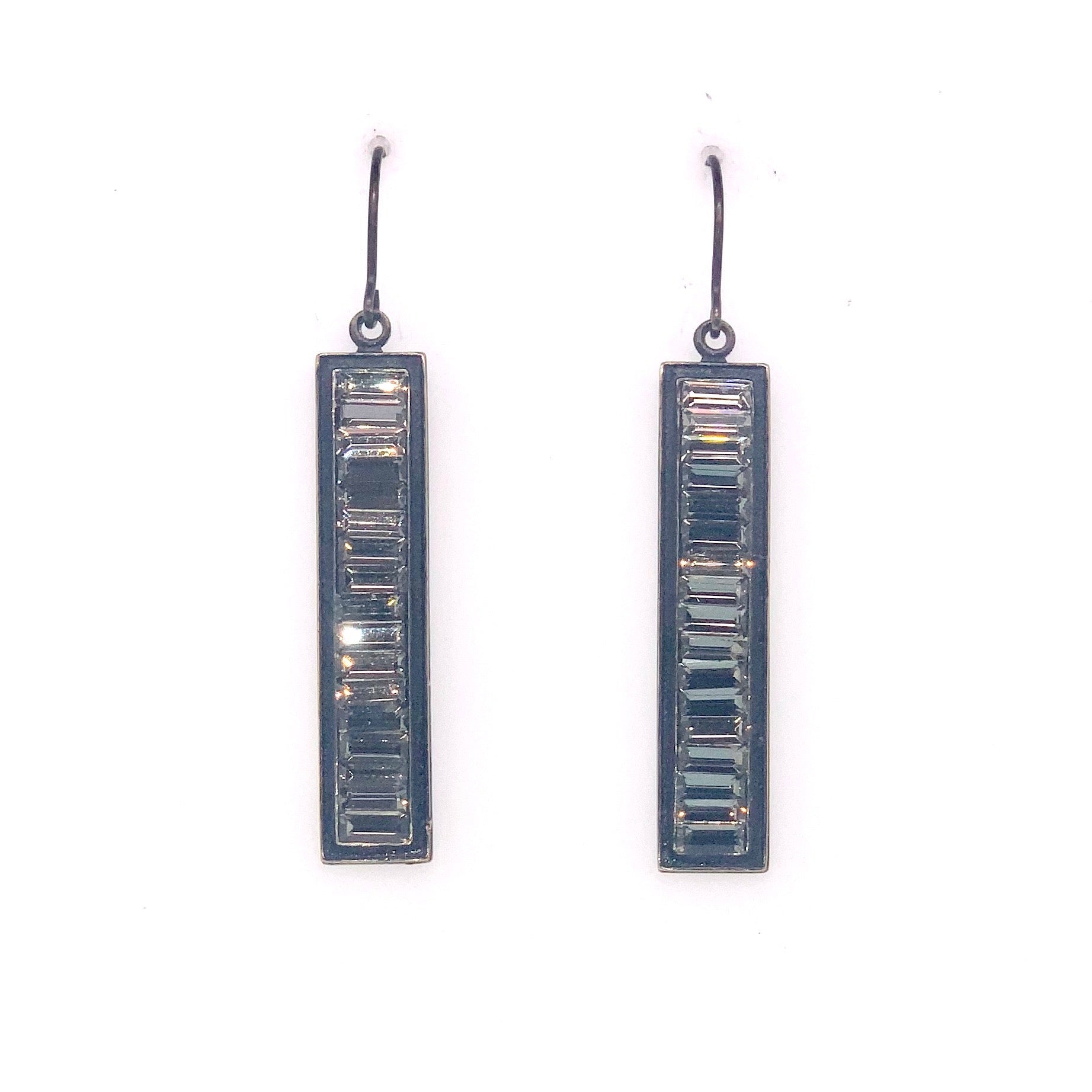 Rebel rectangular baguette crystal drop earrings features antique brass finish with black diamond crystals. 2 1/4" drop. Handmade in Brooklyn.