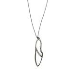 necklace features a small brass leaf pendant with crystal line detail. It has an antique brass finish with black diamond crystals on a 16" chain with lobster clasp closure. Handmade in New York.