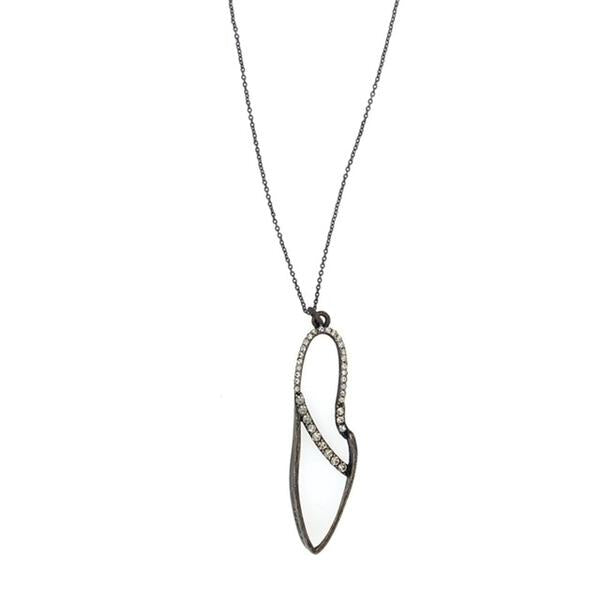 necklace features a small brass leaf pendant with crystal line detail. It has an antique brass finish with black diamond crystals on a 16" chain with lobster clasp closure. Handmade in New York.