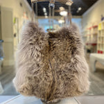 Genuine coyote fur handbag with cow horn handle featured in store. Made in the USA.