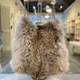 Genuine coyote fur handbag with cow horn handle featured in store. Made in the USA.