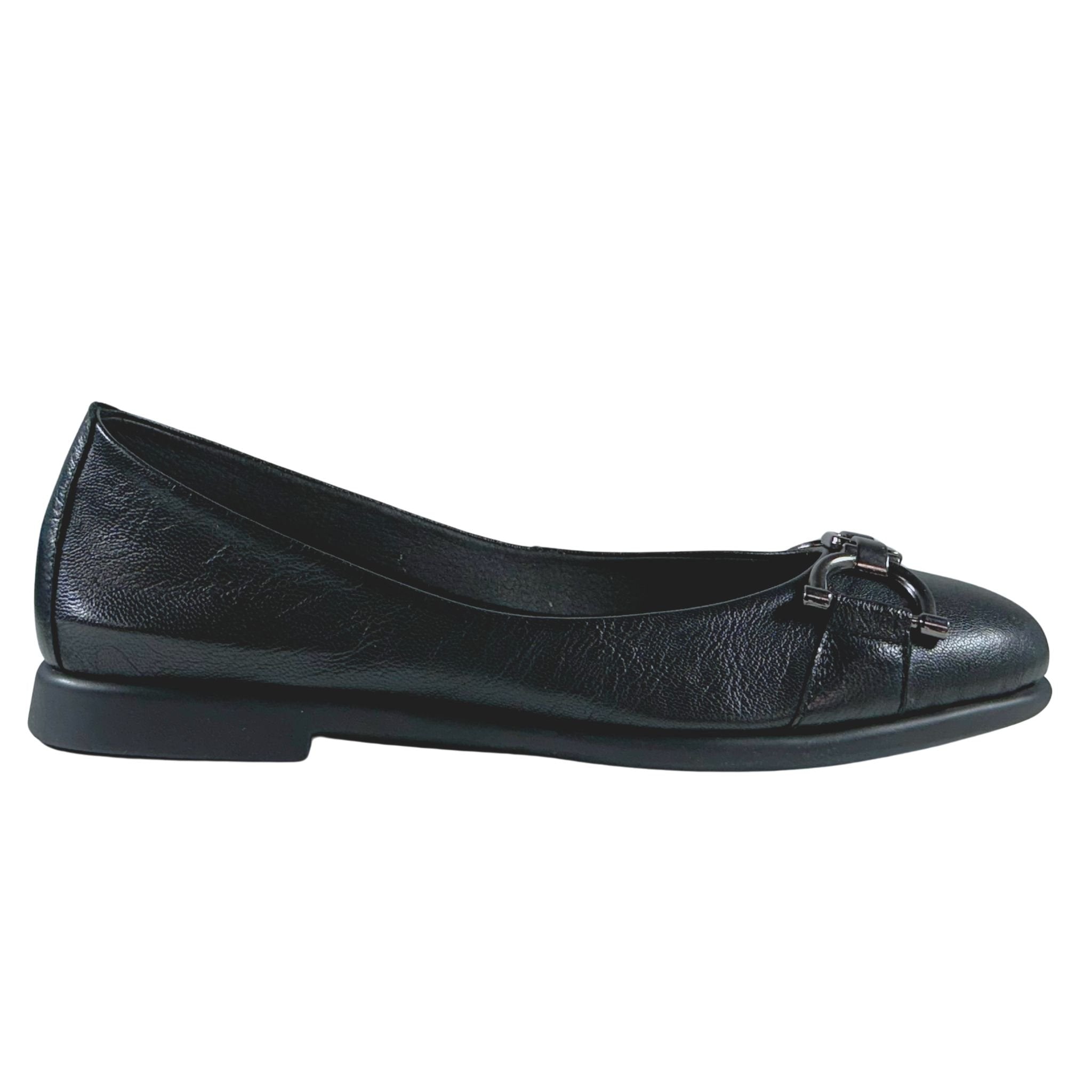 Black leather ballet flat shoe on a white background