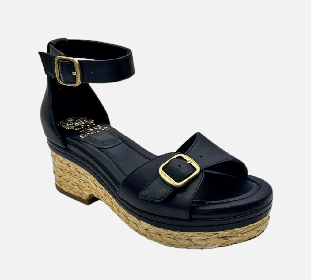 black wedge heel sandal with brassy buckle closure and raffia bottom detail