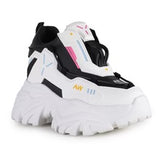 chunky platform sneaker in white with blocks of black and blue details side profile