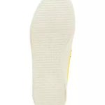 low profile yellow canvas boat shoe sneaker with white laces bottom