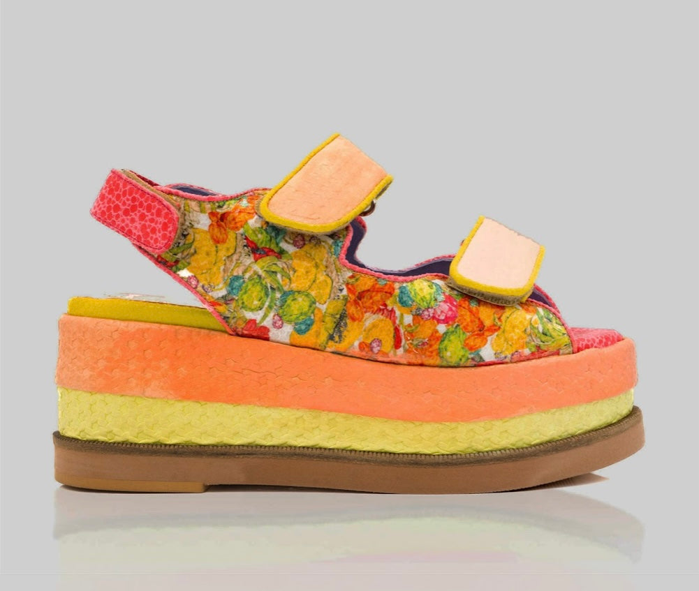 handmade platform sandal in vibrant orange, yellow, and red with adjustable straps detail