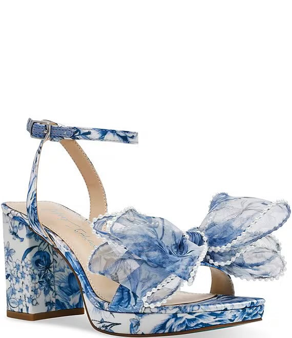 blue and white floral heeled sandal with large bow and buckled strap by Betsey Johnson profile view