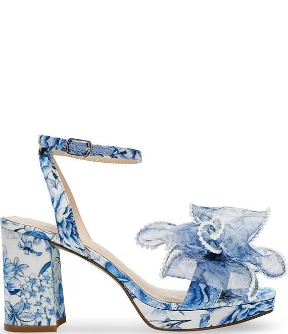 blue and white floral heeled sandal with large bow and buckled strap by Betsey Johnson side view