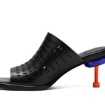 perforated black leather sandal with red and blue architectural heel inner side