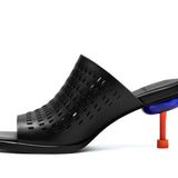 perforated black leather sandal with red and blue architectural heel inner side